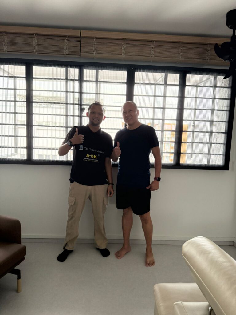 Happy customer with bamboo roll-up blinds installed by The Curtain Expert in a Singapore HDB flat